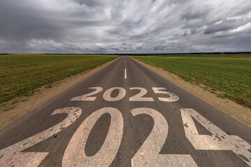 signs 2024, 2025 on asphalt road highway with overcast sky background. concept of destination or...
