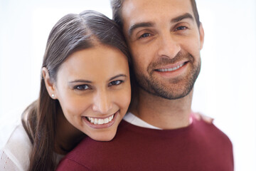 Portrait, hug and happy couple in a house with love, trust and security, support or bonding at...
