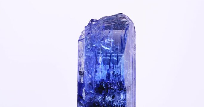 gemmy tanzanite (blue violet zoisite) macro 360&deg; 4k footage on white background