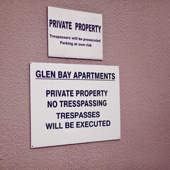 Trespassing, warning and sign on apartment of property for caution, notification and information. Public signage, symbol and private building with board, poster and mistake for attention or safety