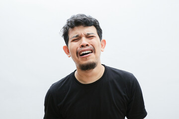Fototapeta premium an asian man crying and screaming