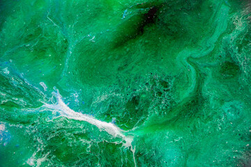 Watery, marbled emerald green texture perfect for backgrounds and graphic design