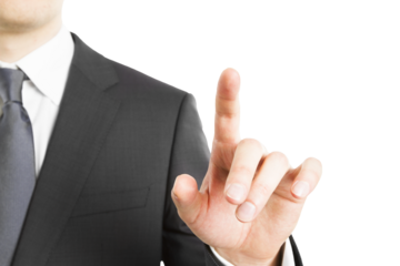 A businessman in a suit touching an invisible virtual screen against a white background, depicting a concept of modern technology