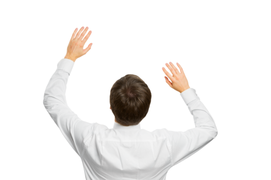 A man in a white shirt making a pushing gesture with both hands, isolated on a white background, concept of interaction with a virtual interface or screen