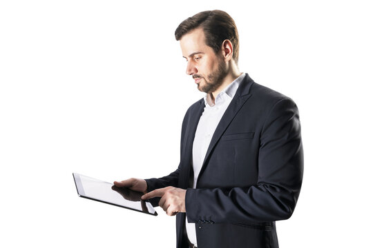 A businessman in a suit using a digital tablet, isolated on a white background, depicting modern technology at work