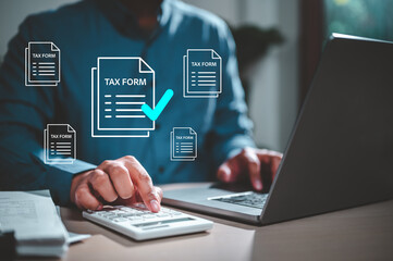 calculate, tax, document, invoice, keyboard, paperwork, report, research, revenue, refund. A man is using a laptop to fill out tax forms. Concept of the importance of accurately completing tax forms.
