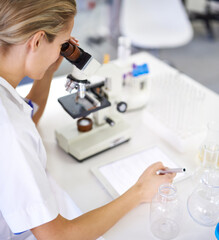 Medical, woman and research with tablet and microscope in lab with development in biotechnology....