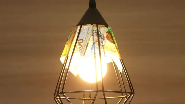 Switzerland energy, Increase in electricity prices in Switzerland, Economic concept, Turning on and off the light lampshade made of Swiss francs