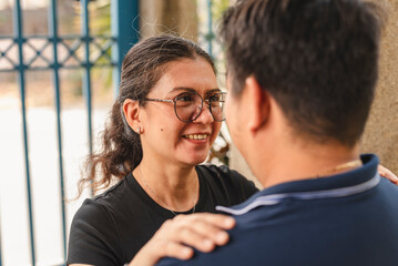 Affectionate middle-aged Asian couple enjoying a tender moment