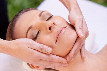 Calm woman, sleeping and face massage with masseuse for zen, skincare or stress relief at spa, hotel or resort. Closeup of female person asleep in relaxation for facial, beauty or body treatment