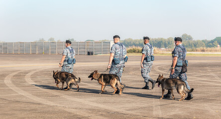 Soldiers from the  K-9 unit demonstrations to attack the enemy , the green lawns. learn the human language. Dogs can follow orders well.