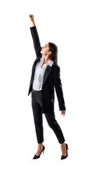 A businesswoman in a black suit is posing with her fist raised high against a white background,...