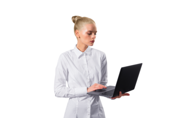 A professional young woman in a white shirt focused on working with a laptop, isolated on a white background, portraying a modern businesswoman