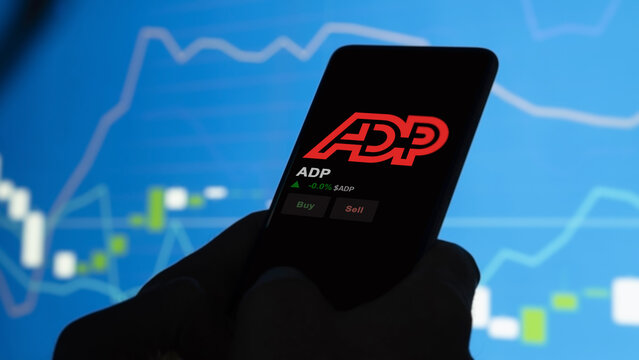 March 23rd 2024 , Roseland, New Jersey. Close up on logo of ADP on the screen of an exchange. ADP price stocks, $ADP on a device.