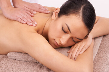 Hands, zen and woman with back massage at spa for wellness, self care and grooming treatment in...
