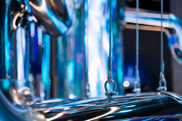 A metal pipe with azure automotive lighting creating a blue glow
