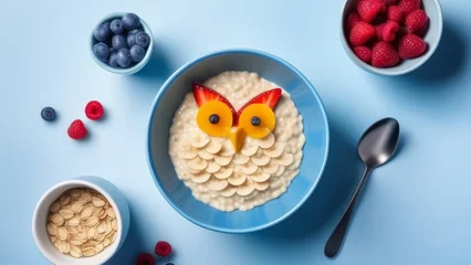Poster Creative breakfast with oatmeal, berries and owl on blue background. generative ai © Sarbinaz Mustafina