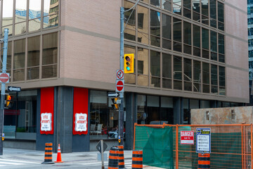 Fototapeta premium general view of street with building facade and sign of Little Anthony's, an Italian restaurant, located at 121 Richmond Street West in Toronto, Canada