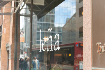 Fototapeta premium exterior building facade display window and sign of Leña Restaurante, a Latin American restaurant, located at 176 Yonge Street in Toronto, Canada