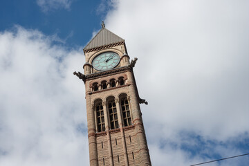 Fototapeta premium clock and bell tower of Toronto Old City Hall, a historical landmark, located at 60 Queen Street West