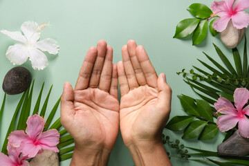 Man's hands on a green background ecological concept
