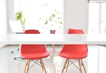 white office with red chairs