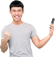 Delighted Asian man with cellphone in hand looking at camera with smile while celebrating success PNG file no background 