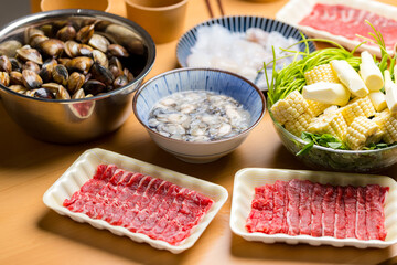 Homemade hot pot with beef and clam
