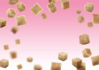 Brown cane sugar cubes falling on pink gradient background