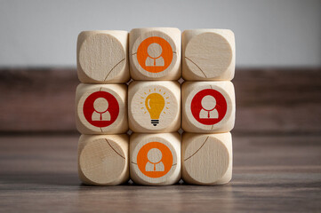 Cubes and dice with light bulb icon and idea - plan do check act on wooden background