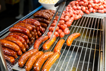 Vendor selling sausage in the street market
