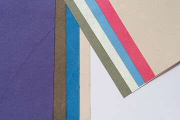 color paper arranged in layered or staggered form with stripes