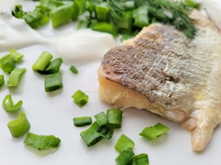 Baked fish with chopped chives.