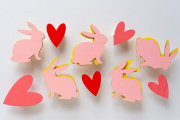 wooden easter rabbit shapes (in pink and yellow) and painted wooden hearts
