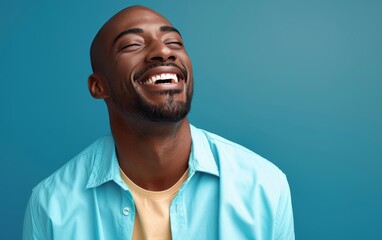 Fototapeta premium A man with a beard and a necklace is smiling and looking at the camera