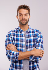 Portrait, arms crossed and man in studio for fashion isolated on a gray background. Cool person, face and confidence in casual clothes for trendy style in shirt outfit on a backdrop in Australia