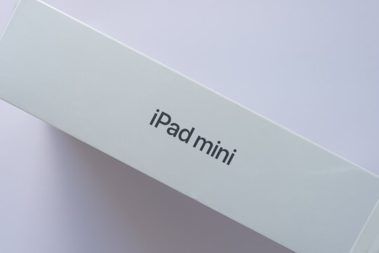 edge of an iPad mini box (albeit with some dust) still covered in shrink wrap