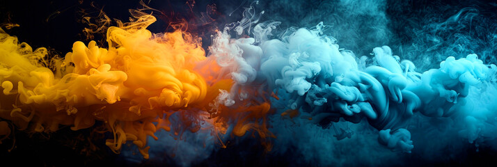 Obraz na płótnie Canvas Colorful blue and yellow smoke merging and swirling while flowing on black background.