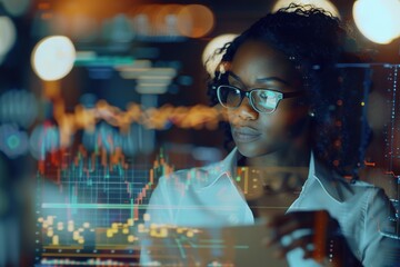 Focused analyst studies complex data charts on screens.