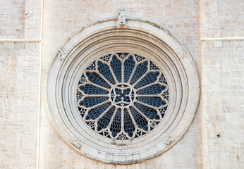 Close-up of the Gothic rose window at Trento Cathedral in Trentino-Alto Adige, Italy, featuring stained glass