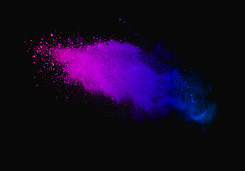 Abstract powder splatted background. Colorful powder explosion on black background. Colored cloud....