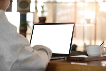 Businessman or student wearing white shirt using laptop for searching, working, online learning, marketing, freelance, studying, distance education network online technology background.	