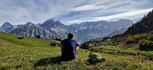 guy watches mountain panorama