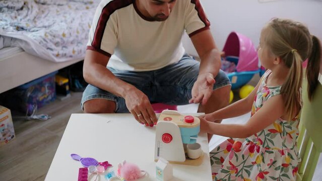 Daughter and father role-playing coffee shop