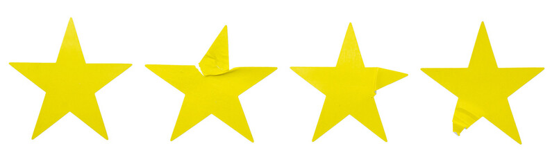 A set of yellow star shape paper sticker label isolated on white background.
