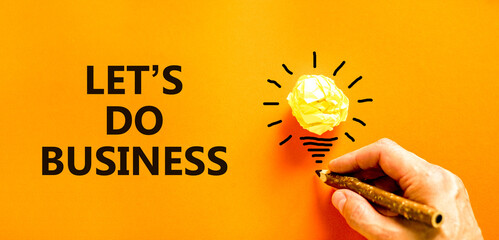 let is do business symbol. Concept words let is do business on beautiful orange paper. Beautiful...