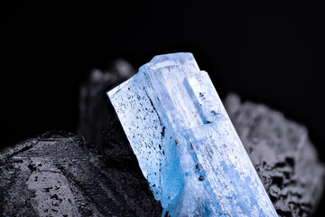 Aquamarine (blue beryl) on schorl (black tourmaline) macro photography detail texture background....