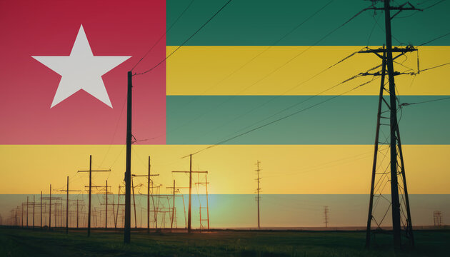 Togo flag on electric pole background. Power shortage and increased energy consumption in Togo. Energy development and energy crisis