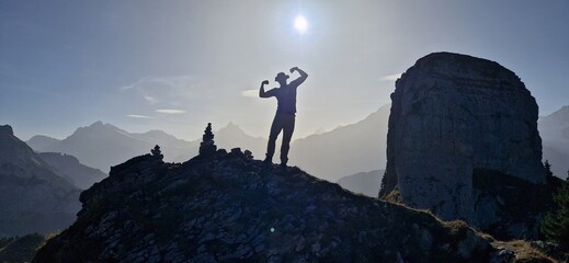 muscle man on the mountain top