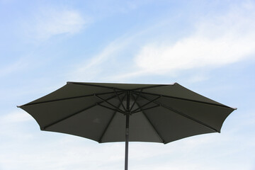 Beautiful beach umbrella, with blue sky behind it, close-up